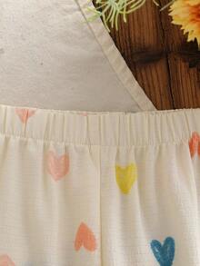 SHEIN Genkimix Kids Conjunto de 2 piezas de estilo europeo y americano para niñas en verano, con top de tirantes con estampado de corazones + pantalones de pierna ancha, de tela de algodón con textura de burbujas, suave y agradable a la piel, apropiado para niñas de 4 a 7 años, adecuado para jugar al aire libre - Albaricoque - Ver 7