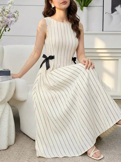 SHEIN Vestido de verano de moda para adolescentes con estampado de rayas, contraste de color, decoración de lazo, sin mangas y cintura ceñida