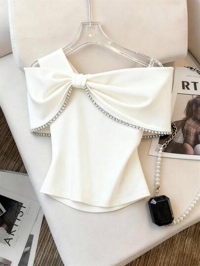 Franclia Top à épaules dénudées avec bordure de strass : Style chic français, décoré d'un grand nœud + bordure de chaîne de strass, silhouette à épaules dénudées mettant en valeur les épaules délicates et la ligne du cou. Convient pour les rendez-vous, les fêtes, etc.