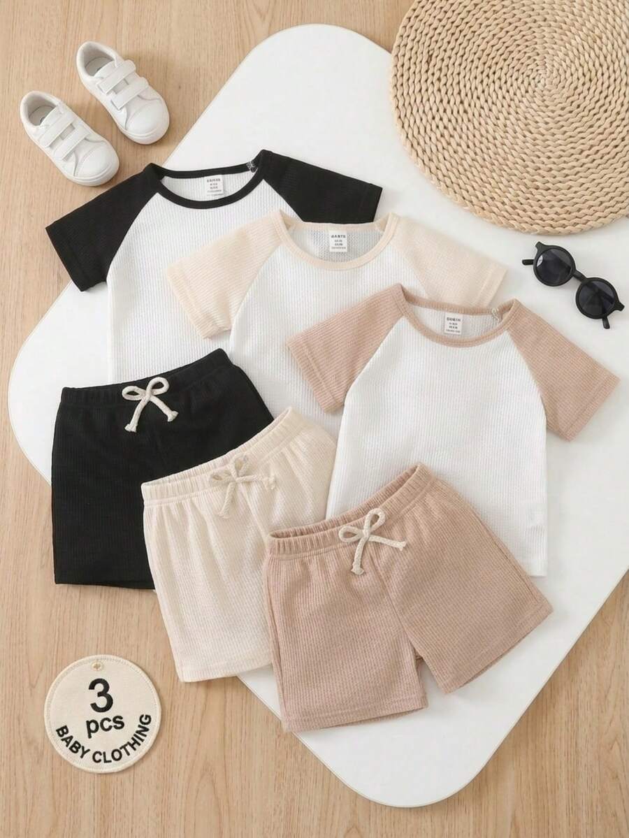 SHEIN Vintaside Kids 6 piezas de conjuntos casuales para bebés y niños pequeños, incluyendo camisetas de manga corta de cuello redondo con mangas raglán en azul marino, verde claro, naranja claro y blanco, y pantalones cortos deportivos, adecuados para el verano - Multicolor - Ver 1