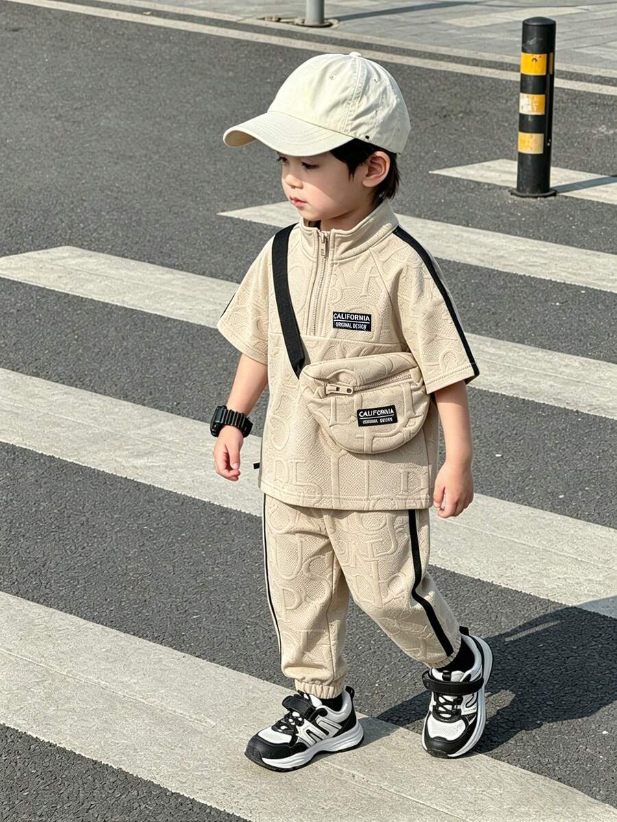SHEIN Bộ 2 món áo polo và quần jogger cho bé, màu be phối sọc đen, kèm túi đeo chéo cùng màu có logo hình ngựa, thích hợp mặc hàng ngày. - Màu Khaki - Xem 1