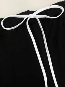 GlowEve CURVE Plus Size 2-Piece Set: Contrast Color Short Sleeve T-Shirt With Contrast Trim And Button Detail, Paired With Elegant Straight Leg Slim Fit Pants - Black and White - View 5