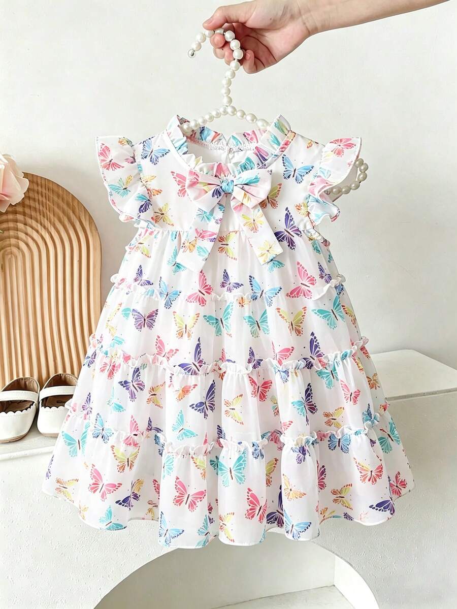 SHEIN 女婴时尚休闲度假碎花蝴蝶结装饰蛋糕裙，适合春季、夏季、秋季、度假、节日、派对、日常穿着