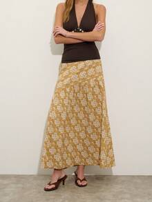 Nöista 这款芥末黄印花高腰长裙，斜向缝线设计，营造出动感和廓形。非常适合春夏穿着，是度假、参加音乐节或日常休闲装扮的理想之选。 - 鵝黃色 - 查看 5