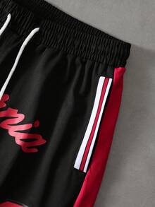 PAVTROS Pantalones cortos de baloncesto con estampado numérico de color contrastante para hombres - Negro - Ver 5