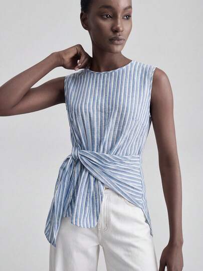 Ontre 2026SS New Arrival Women's Blouse, Comfortable Skin-Friendly Fitted Sleeveless Design With Waist Pleated Bow, Elegant For Wedding Guest, Minimalist Romantic French Chic Luxury Urban Casual Business Office Wear, High-Quality Airport Cruise Outfit, Middle East Essential, All-Season Versatile Wedding Guest Series Bohemian Style Top