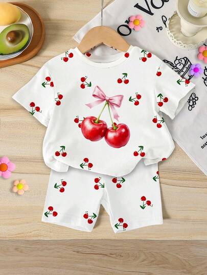 Bộ 2 món gồm áo thun in hình quả anh đào và quần short bó sát cho bé gái, thích hợp cho mùa hè đi học, ở nhà, dã ngoại, trang phục hè dễ thương, phong cách Hàn Quốc.