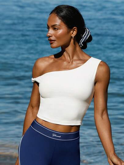 GLOWMODE Áo croptop FeatherFit™ mềm mại như bơ, thấm hút mồ hôi, dài đến eo, có đệm vai, lệch vai, xoắn bên hông, thích hợp cho kỳ nghỉ hè, du lịch, mặc hàng ngày.