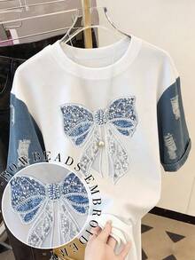 Resyla Áo thun nữ thời trang thường ngày cổ tròn vai rớt, chất liệu giả denim phối nhiều mảng, áo thun phối nhiều mảng thêu nơ ngọc trai, áo thun nơ, áo thun ngọc trai, áo thun phối nhiều mảng, áo thun thường ngày thoải mái mặc ngoài trời, áo thun bốn mùa, áo thun giả denim. - trắng - Xem 1