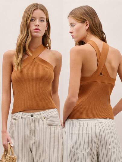 Nöista Áo tank top dệt kim gân với cổ yếm chéo phía trước. Kiểu dáng tôn dáng và hiện đại, hoàn hảo cho mùa hè, lý tưởng cho các bữa tiệc, buổi tối đi chơi hoặc phong cách thường ngày thanh lịch.