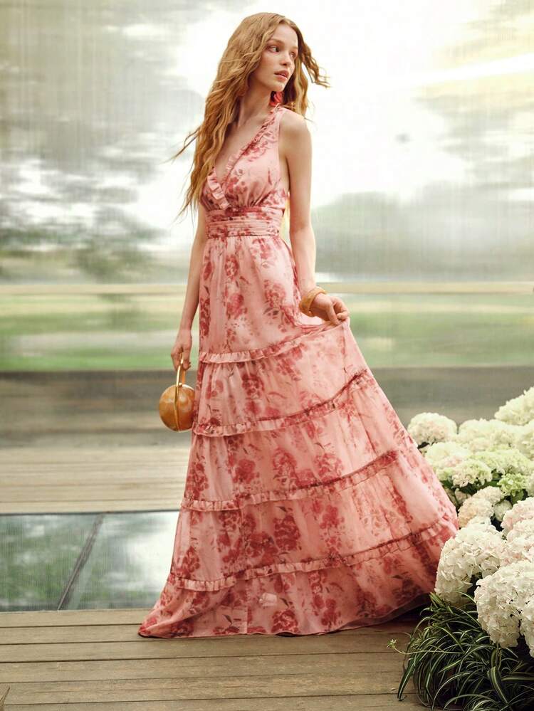ROMANTIC SLEEVELESS V-NECK MAXI DRESS FOR WOMEN | RUFFLED V-NECK TRIM & LAYERED RUFFLED DRESS WITH VOLUMINOUS HEM, WAIST SHIRRED DETAILING, BACK CRISSCROSS STRAP DESIGN, PINK BASE WITH RED RANDOM FLORAL PATTERN FABRIC, BODYCON FIT FOR SPRING/SUMMER, VALENTINE'S DAY, ROMANTIC DATES, GARDEN PARTIES, WEDDING GUESTS & SPRING CELEBRATIONS