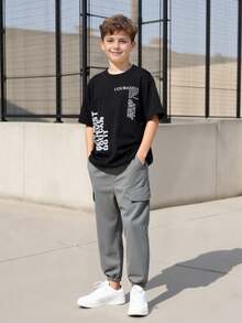 2pcs/Set Teen Boys Black T-Shirt Paired With Khaki Shorts, T-Shirt With Matching Pocket, Fashionable Versatile Outfit Suitable For Sports, Outings, School, Various Occasions, Essential Summer Attire For Teenagers - Grey - View 1