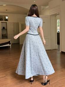 Bộ 2 món áo và chân váy in nơ phối viền tương phản dành cho nữ. - Xám - Xem 6