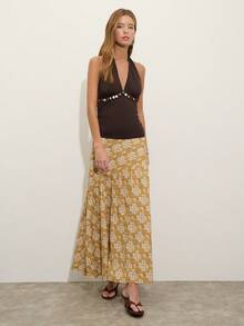 Nöista 这款芥末黄印花高腰长裙，斜向缝线设计，营造出动感和廓形。非常适合春夏穿着，是度假、参加音乐节或日常休闲装扮的理想之选。 - 鵝黃色 - 查看 11
