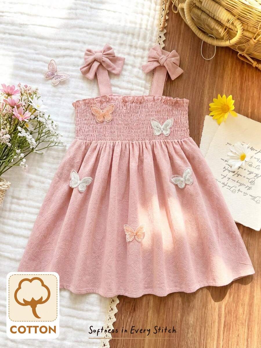 Cozy Pixies Vestido casual rosa de manga corta con volantes, moño y mariposas 3D para niña pequeña, vestido versátil de uso diario para bebés y niños pequeños, estilo primavera/verano y vacaciones - Rosa Pálido - Ver 1