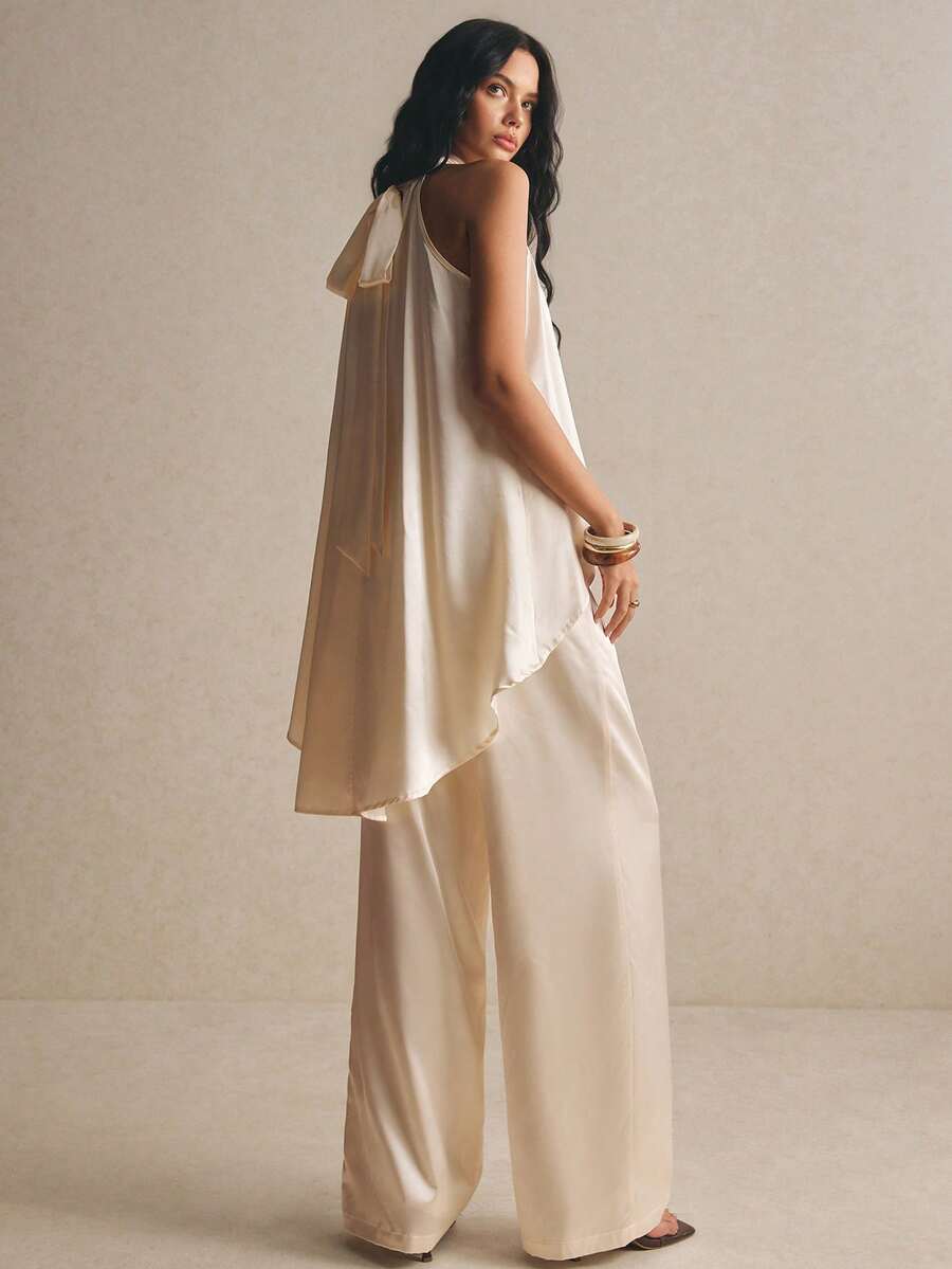 Poéselle Bộ 2 áo nữ bằng vải satin, cổ yếm, vạt bất đối xứng, màu trắng.