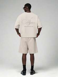 STYNVO Bộ áo thun cổ tròn in chữ và quần short rộng dành cho nam. - Màu be - Xem 1