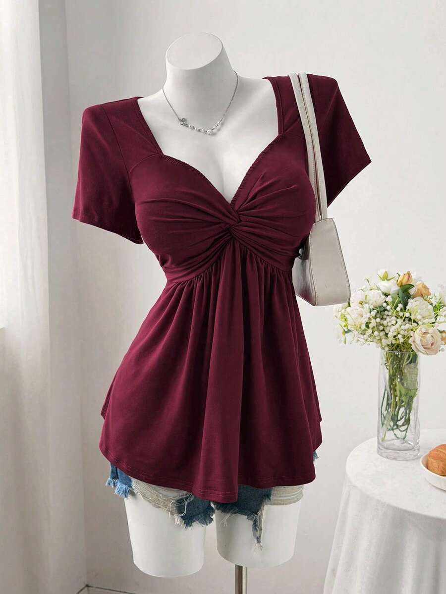 Sweetra Áo thun ngắn tay màu trơn dáng rộng dành cho nữ cỡ lớn, kiểu xoắn phía trước. - Màu Đỏ Sâu - Xem 1