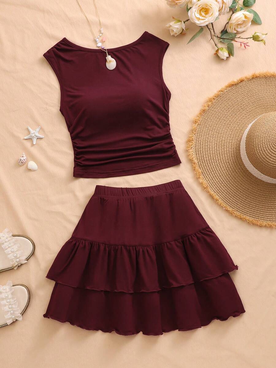 SHEIN 这款全新两件套少女套装，时尚休闲，充满度假风情。舒适的弹力针织提花蓝色圆领套头背心搭配同色系双层蛋糕裙，尽显优雅气质。背心的腰部和下摆采用褶裥设计，打造出精致优雅的整体造型。这款高品质套装适合日常穿着，也适合度假、旅行和聚会等场合，是春夏的理想之选。 - 酒紅色 - 查看 1