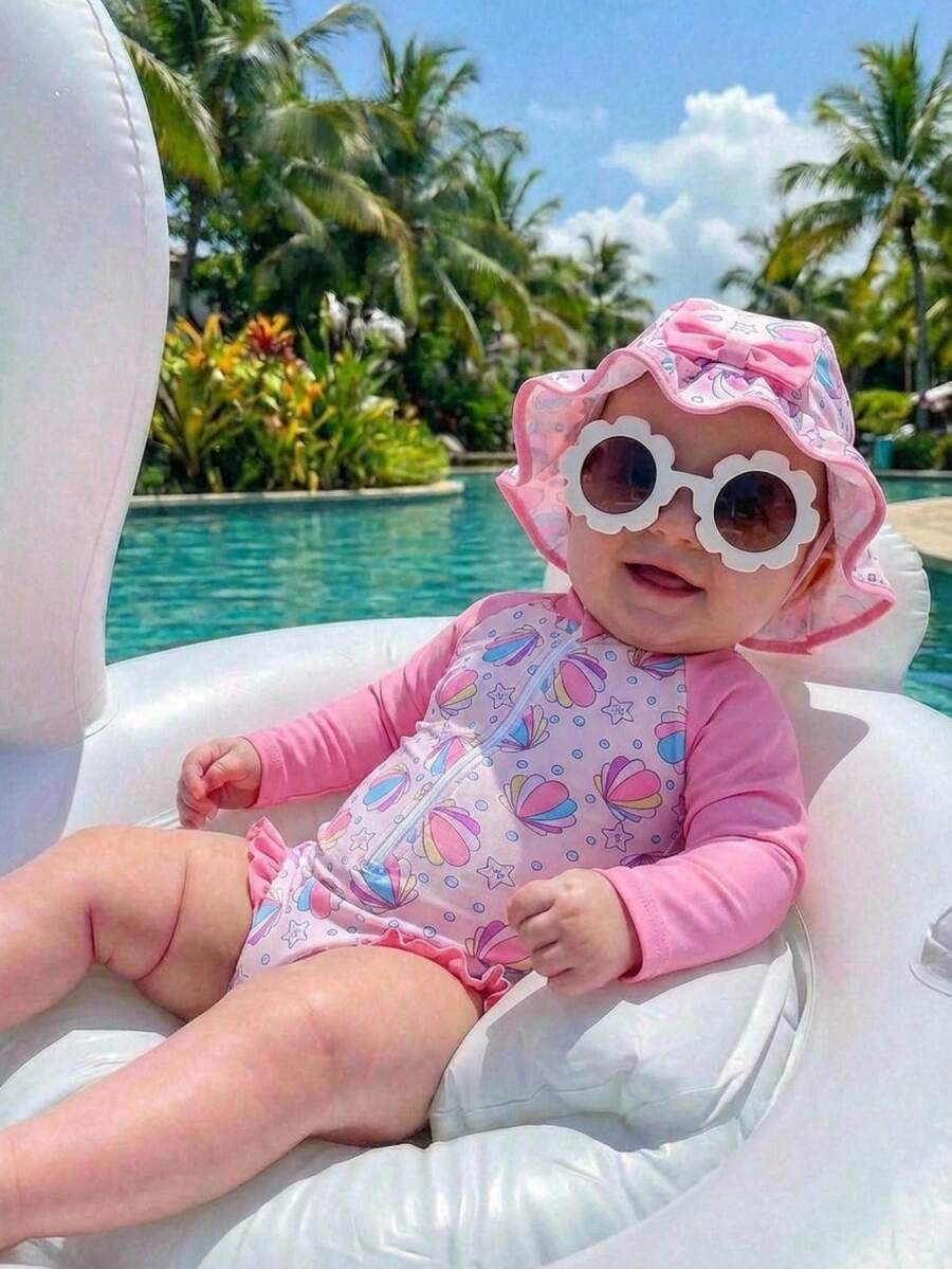 SHEIN Bộ đồ bơi dài tay chống nắng 2 món cho bé gái sơ sinh/trẻ nhỏ, có khóa kéo, kèm mũ nơ xinh xắn và họa tiết hoa, bao gồm mũ. Đồ bơi cho bé gái sơ sinh kèm mũ, quần áo trẻ em chủ đề biển, đồ bơi dài tay cho bé, đồ bơi dài tay cho bé gái sơ sinh, mũ đi biển cho bé gái, đồ bơi cho bé gái sơ sinh, đồ bơi kèm mũ cho bé, đồ bơi màu hồng cho bé gái sơ sinh, đồ bơi cho bé gái, đồ bơi chống nắng cho bé gái sơ sinh, đồ bơi chống nắng cho trẻ nhỏ, đồ bơi cho bé gái, đồ bơi dài tay in hình vỏ sò cho bé gái sơ sinh, đồ bơi dài tay cho bé, bộ đồ đi biển cho bé, đồ bơi in hình biển cho bé gái sơ sinh, đồ bơi in hình vỏ sò cho bé gái sơ sinh - Hồng - Xem 1