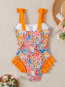 SHEIN Bộ đồ bơi liền thân cho bé gái tuổi teen với nơ và họa tiết hoa, hoàn hảo cho các bữa tiệc bãi biển mùa hè, kỳ nghỉ gia đình và du lịch. - Nhiều màu - Xem 2
