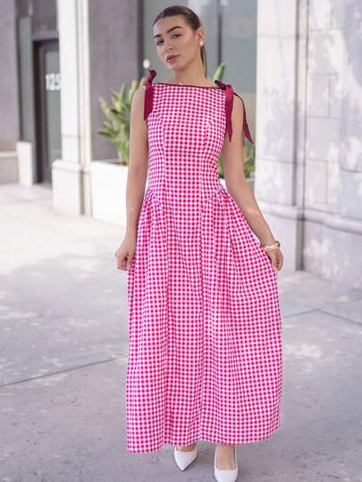 Andrea Bello 红色格子无袖连衣裙，饰有蝴蝶结，裙摆呈喇叭形，适合圣诞节和新年穿着。