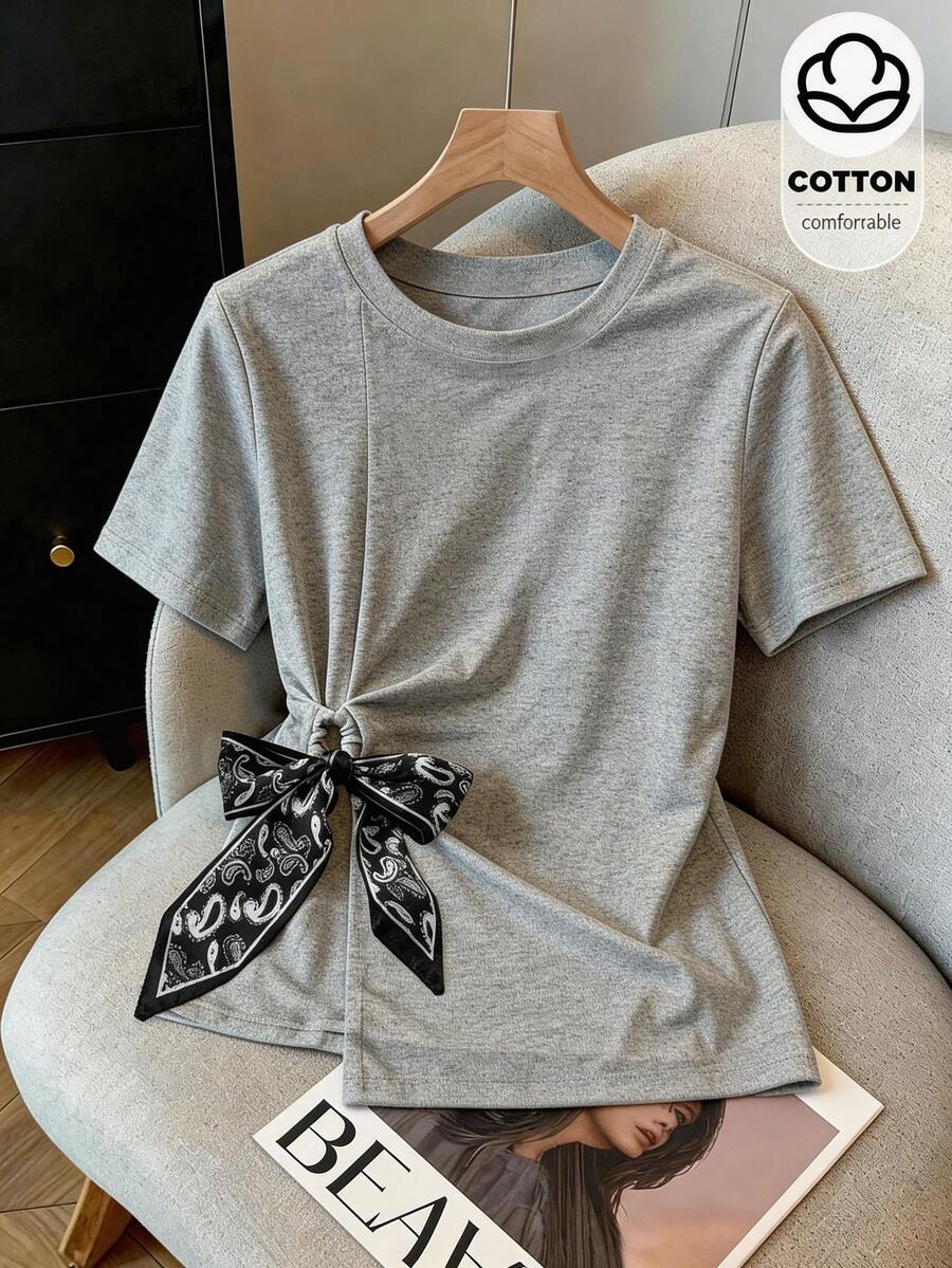 Franclia Women's Grey Summer Casual Everyday Cotton T-Shirt, Round Neck Short-Sleeved Side Twist Design Top With Silk Scarf Bow, Asymmetric Hem Tee - Grey - View 1