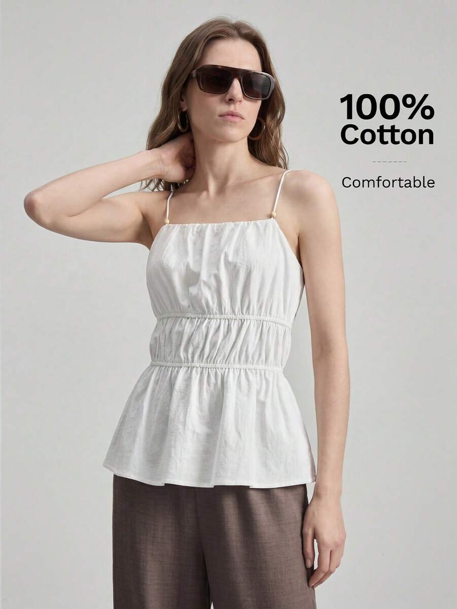 Ontre 女士米色舒适柔软面料修身褶皱设计吊带背心，后背交叉绑带，流苏肩带装饰，简约休闲，适合邮轮度假、高端都市通勤办公穿着，四季皆宜，打造波西米亚风度假造型，也适合海滩、海边、乡村音乐会、西部风格等场合，是夏季休闲时尚女装的理想之选。价格亲民，适合各种场合，打造波西米亚风度假造型。 - 白色 - 查看 1