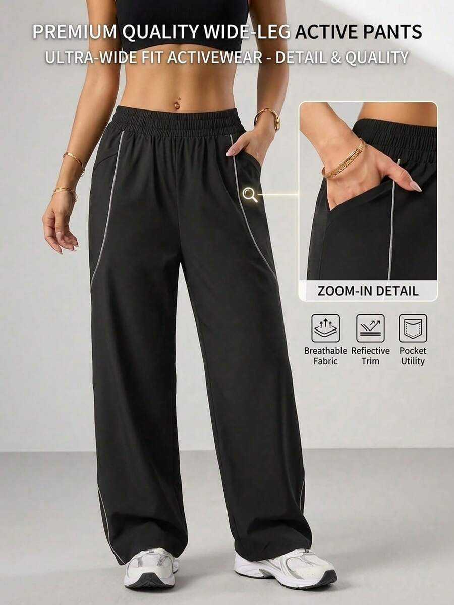 Eassivo Eassivo Women's Workout Pants, Loose Fit Elastic Waist Sports Pants With Reflective Stripe And Double Side Pockets For Running, Gym And Daily Wear - Black - View 1