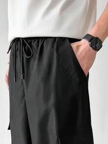 PAVTROS Men's Casual Solid Color Multi-Pocket Loose Straight Leg Cargo Pants - Black - View 6