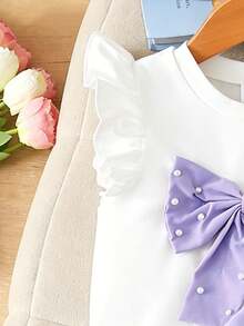 Elladie kids 4-7岁女童两件套：可爱蝴蝶结装饰串珠短袖上衣和松紧腰串珠开衩短裤，适合日常生活、派对和其他场合。 - 紫色 - 查看 7