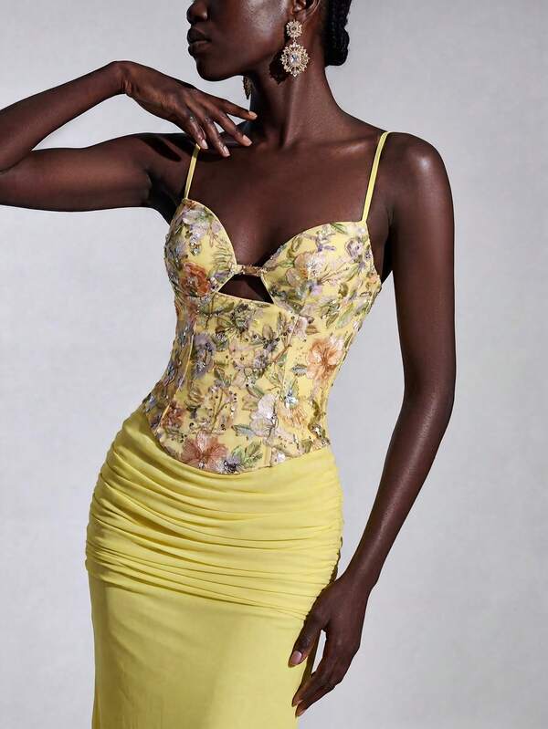 Elitara Elegant, Glamorous, And Fashionable, This Pale Yellow Gown Features Sequined Embroidery And Stretch Mesh Detailing. It Includes A Halter Neck, Cutout Design, Draped Details, And A Fishtail Train. Perfect For Weddings, Bachelorette Parties, Resort Parties, Proms, And Evening Gowns.