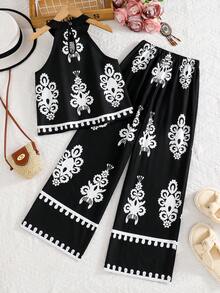 Sparklyn Đây là một bộ đồ hai mảnh dành cho bé gái. Bộ đồ gồm một áo ba lỗ tay ngắn không cổ có họa tiết in, và một quần ống rộng dáng suông. Bộ đồ này rất phù hợp cho bé gái mặc thường ngày hoặc trong những kỳ nghỉ hè. - màu đen - Xem 2