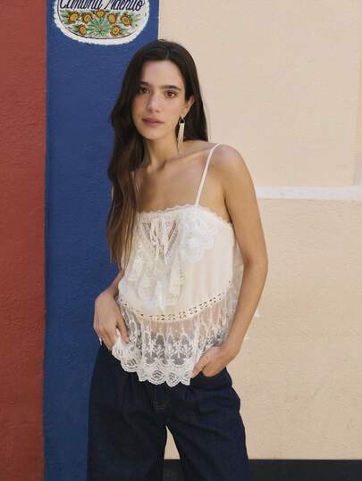 Nöista White Lace Camisole Top Features Multi-Layered Ruffles And A Sheer Embroidered Hem, Exuding A Fresh, Girlish, Pastoral, And French Romantic Charm. Comfortable And Flowy For Summer Wear, It's Suitable For Everyday Wear, Vacations, Photoshoots, And More, Making It A Stylish And Practical Summer Look.