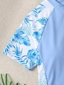 Bộ đồ thể thao cho bé gái tuổi teen, gồm áo chống nắng tay raglan in họa tiết lá xanh, có khóa kéo và quần short. - Màu xanh nhạt - Xem 3