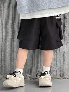 SHEIN Little Byeori Kids/Young Boys' Casual Solid Color Loose Cargo Shorts With Large Pockets, Elastic Waist, Comfortable And Versatile Black Shorts, Suitable For School, Birthday Parties, Performances, Weddings, Baptisms, School Openings, Daily Wear, Spring And Summer - Black - View 2
