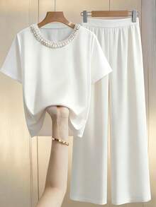 GlowEve CURVE Conjunto casual de 2 piezas con decoración de perlas y cuello redondo para mujeres de talla grande, nueva colección primavera/verano - Beis - Ver 1