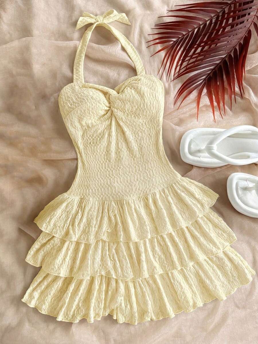 SHEIN Vestido Mini de Férias para Meninas Pré-Adolescentes com Busto Franzido Elástico, Decote com Laço, Laço e Franzido em Camadas, Pode Ser Usado por Dentro ou por Fora, Vestidos de Verão, Vestido Branco Sólido - Amarelo - Visão 1