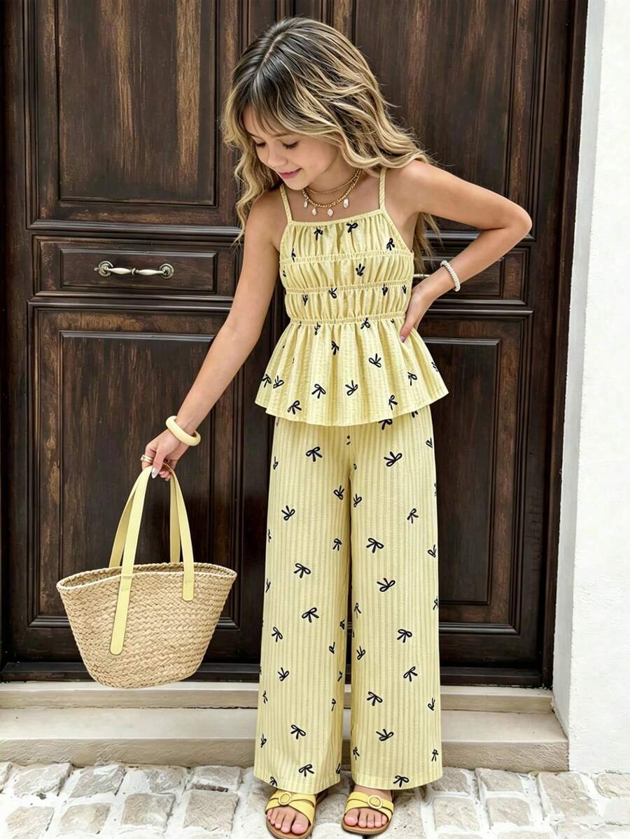 SHEIN Bộ đồ hè cho bé gái gồm áo hai dây kẻ sọc thắt nơ và quần ống đứng, kiểu dáng rộng rãi thoải mái, phù hợp cho mặc hàng ngày, dã ngoại, dự tiệc và đi biển. - Màu vàng - Xem 1