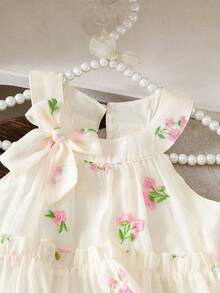 Elladie kids Đầm cổ yếm cho bé gái với họa tiết hoa, nơ trang trí ở cổ, kiểu dáng tươi tắn và dịu dàng, thích hợp cho các chuyến đi chơi mùa hè, ngọt ngào và dễ thương, chiếc đầm hè giản dị và đa năng. - Màu be - Xem 5