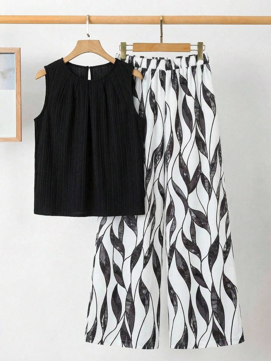 SHEIN Clasi Bộ đồ nữ thanh lịch gồm áo sơ mi xếp ly màu trơn và quần ống rộng in họa tiết cây cỏ, set 2 món mùa hè cho nữ, trang phục mùa hè cho nữ, bộ đồ phối váy và áo mùa hè cho nữ, bộ quần áo nữ. - màu đen - Xem 1