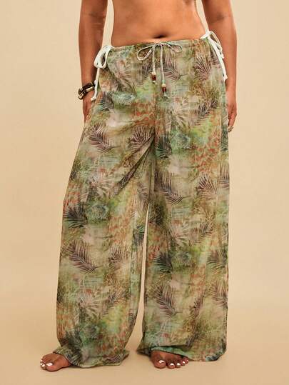 Travachic Quần ống rộng dáng suông in họa tiết lá nhiệt đới, chất liệu chiffon nhẹ, có dây rút ở eo, thích hợp mặc ngoài đồ bơi mùa hè cho nữ.