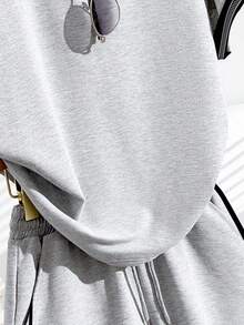 Bộ đồ 2 mảnh cho bé gái tuổi teen - Áo thun tay raglan dáng rộng màu xám và đen phối nơ + Quần short có túi dây rút, trang phục thể thao thường ngày, thiết kế mùa hè, đa năng, cơ bản, ngoài trời, áo thun cổ tròn tay ngắn mềm mại, phù hợp cho mặc hàng ngày, kỳ nghỉ, lễ hội, phong cách mùa xuân và mùa hè. - Nhiều màu - Xem 4
