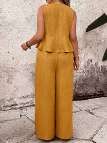 Bộ đồ 2 món cỡ lớn: Áo croptop không tay cổ tròn họa tiết hoa và quần ống rộng. - Màu vàng - Xem 2
