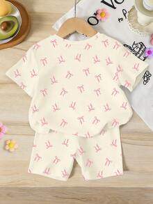 Elladie kids 一套女童休闲时尚甜美可爱蝴蝶结印花粉色大蝴蝶结猫咪图案短袖T恤和骑行短裤套装，适合外出、休闲、节日等场合。浅杏色夏季套装 - 彩色 - 查看 2