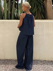 Bộ đồ nữ gồm áo hai dây rộng rãi và quần jeans ống đứng, thích hợp cho mùa xuân và mùa hè. - Màu xanh lam - Xem 2