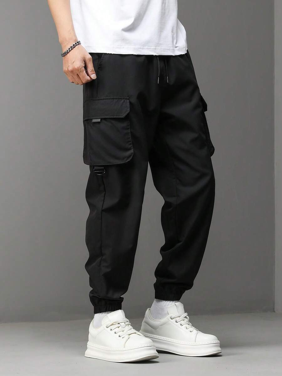 Manfinity Hypemode Pantalones cargo de moda casual para hombre con cintura con cordón, bolsillo con solapa y puños, adecuados para el uso diario - Negro - Ver 1