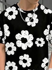 两件套休闲印花青少年男童套装，黑色T恤搭配白色花朵图案短裤，适合春夏日常穿着、旅行和轻度运动。 - 彩色 - 查看 4