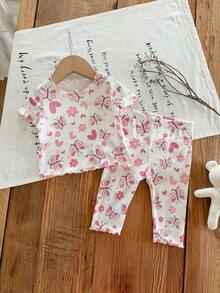 SHEIN LMoss Kids Conjunto de pijama suave de 2 piezas para recién nacida, con cuello redondo, manga corta y estampado de dibujos animados con volantes - Multicolor - Ver 3