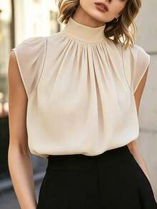 米色立领无袖衬衫，采用柔和的褶裥设计，修身剪裁，面料柔软亲肤，尽显优雅气质，适合通勤和日常穿着。 - 粉色 - 查看 6